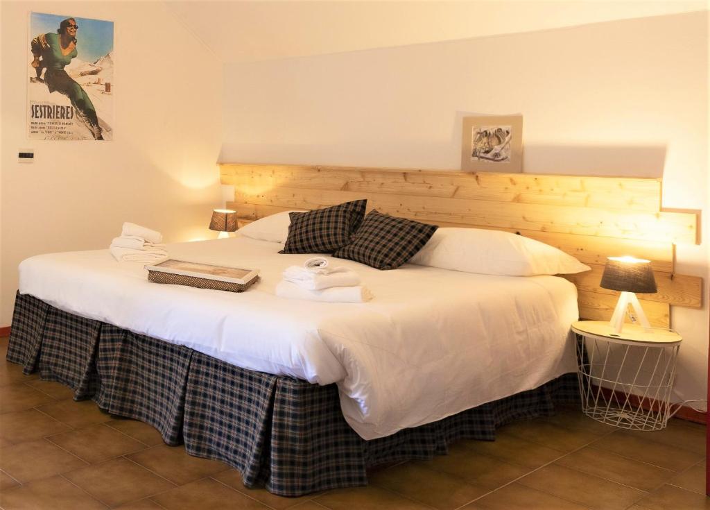 Postel nebo postele na pokoji v ubytování Aparthotel Claviere
