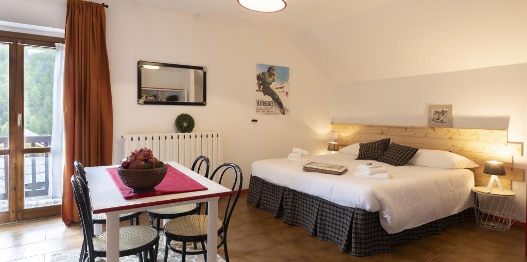 Postel nebo postele na pokoji v ubytování Aparthotel Claviere