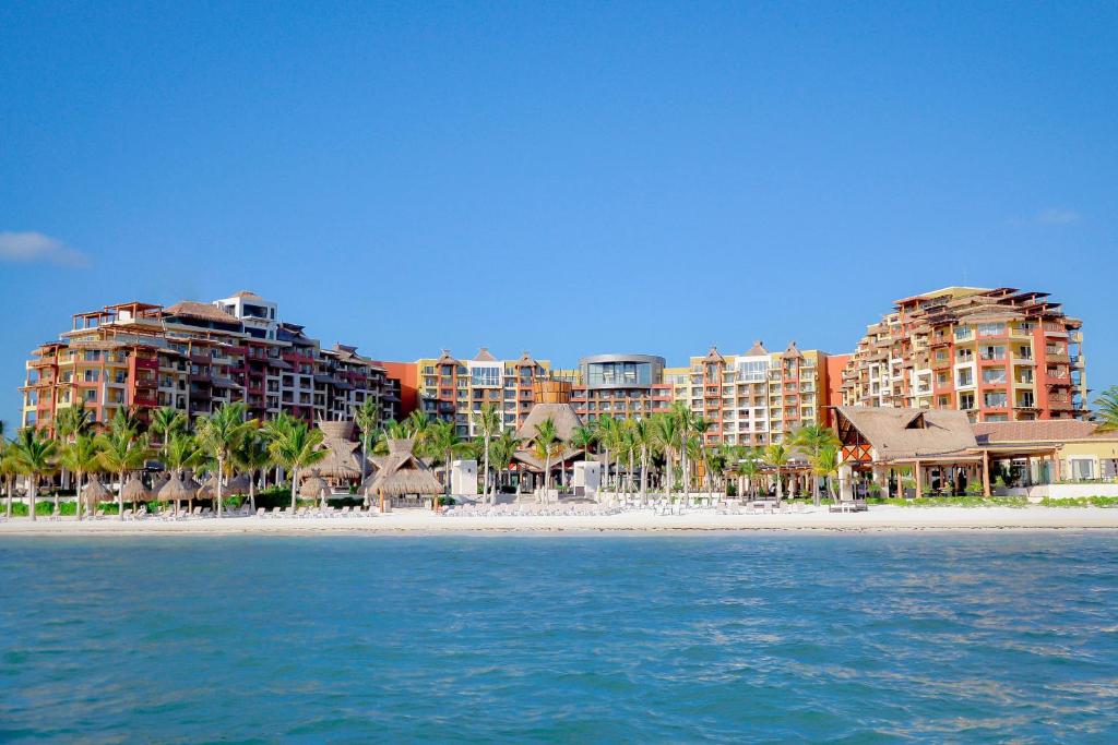 a view of a resort from the water at Villa del Palmar Cancun Luxury Beach Resort & Spa in Cancún