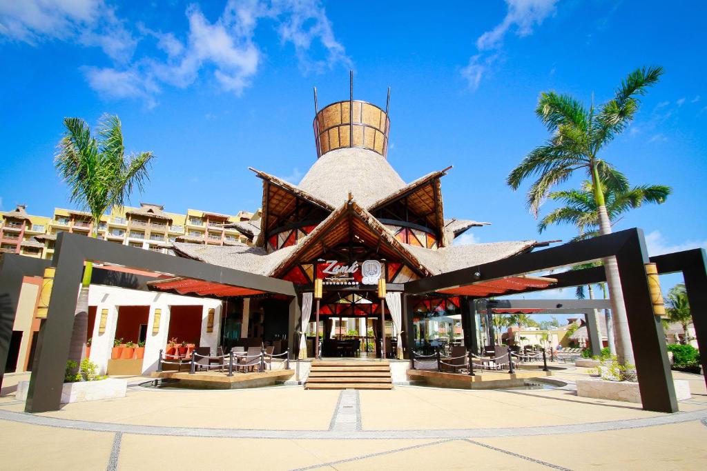 a building with a barrel on top of it at Villa del Palmar Cancun Luxury Beach Resort & Spa in Cancún