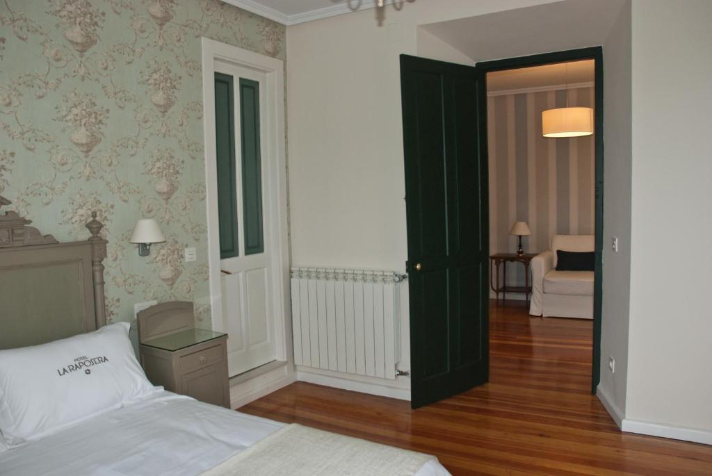 Postel nebo postele na pokoji v ubytování Hotel Rural La Raposera