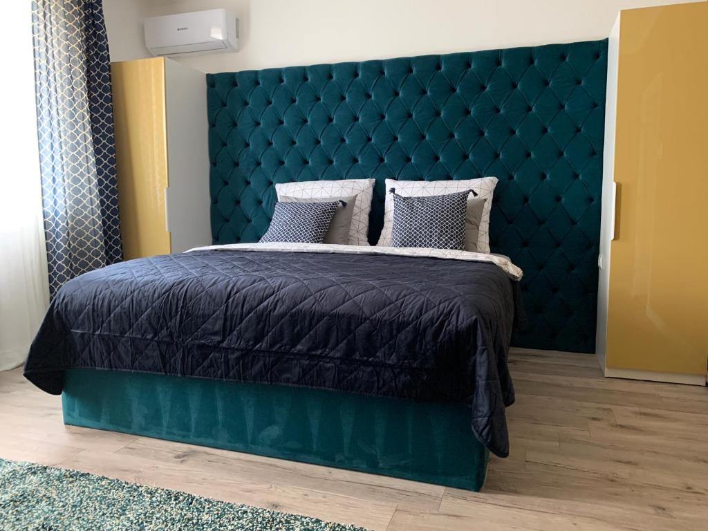 Voodi või voodid majutusasutuse Hollik Apartmanház toas