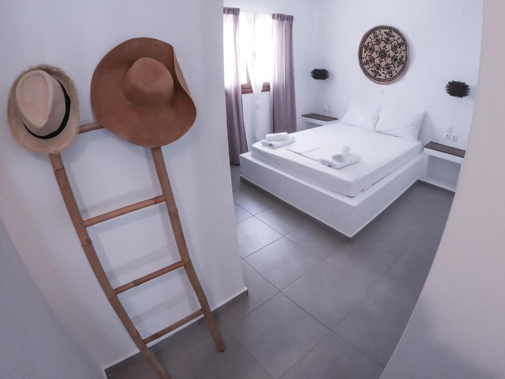 a room with a ladder and a bed and a hat at Joanna's Home in Meyisti