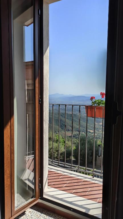 a view from a window of a balcony at “Sa Scala” Bed&Terrace in Baunei