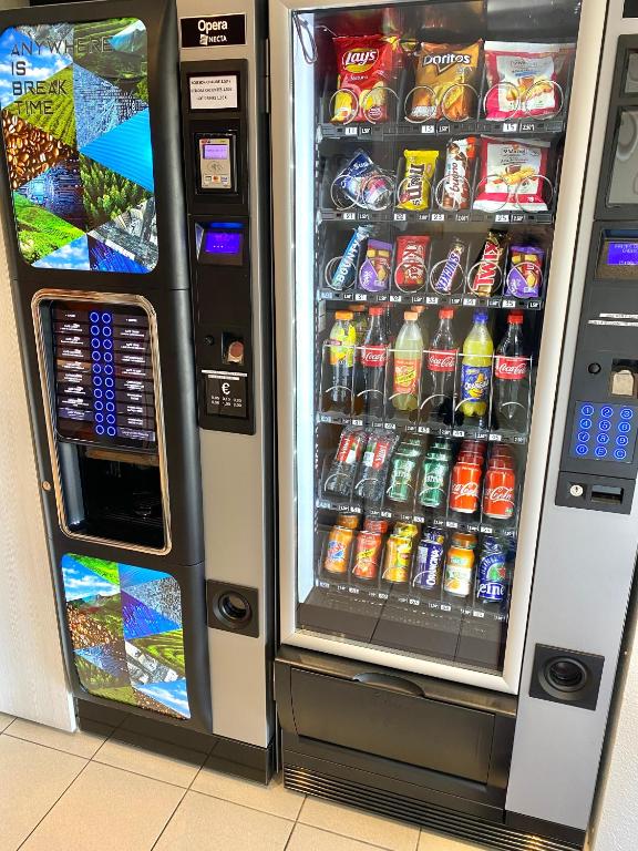 a vending machine filled with lots of drinks at Premiere Classe Perpignan Sud in Perpignan