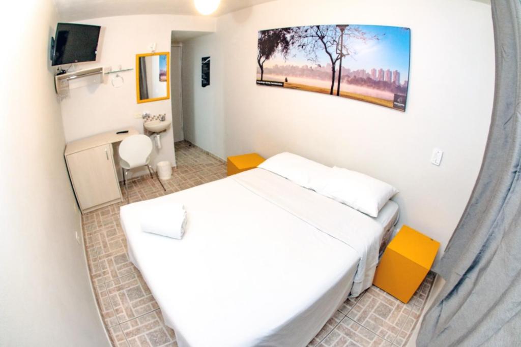 Llit o llits en una habitació de Esquina Batel - Hotel Econômico