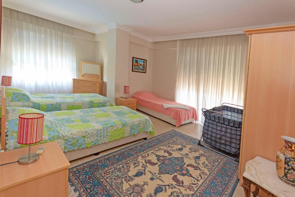A bed or beds in a room at Paradise Town Villa Orchard