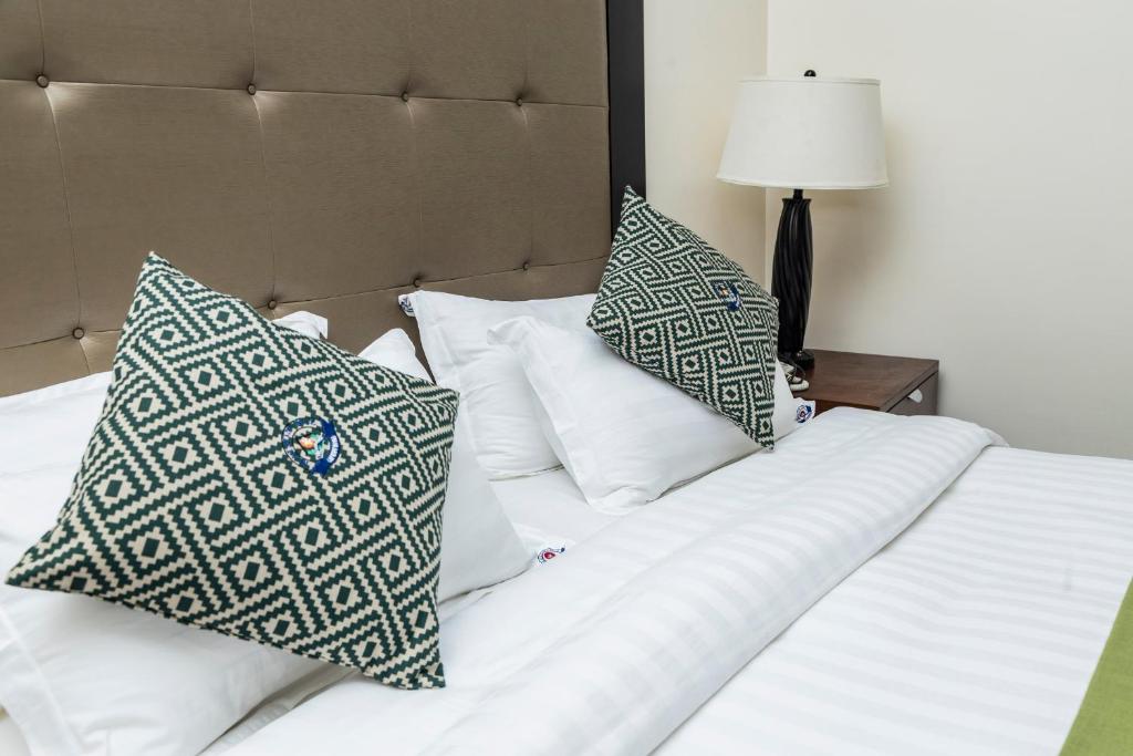 Postel nebo postele na pokoji v ubytování Cap Kivu Hôtel