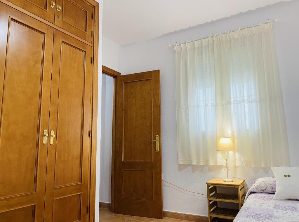 Posteľ alebo postele v izbe v ubytovaní Apartamento Conil Santa Clara