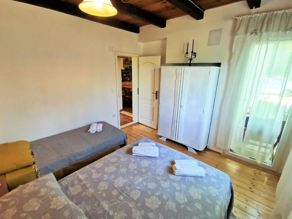 Postel nebo postele na pokoji v ubytování Villa Kućica