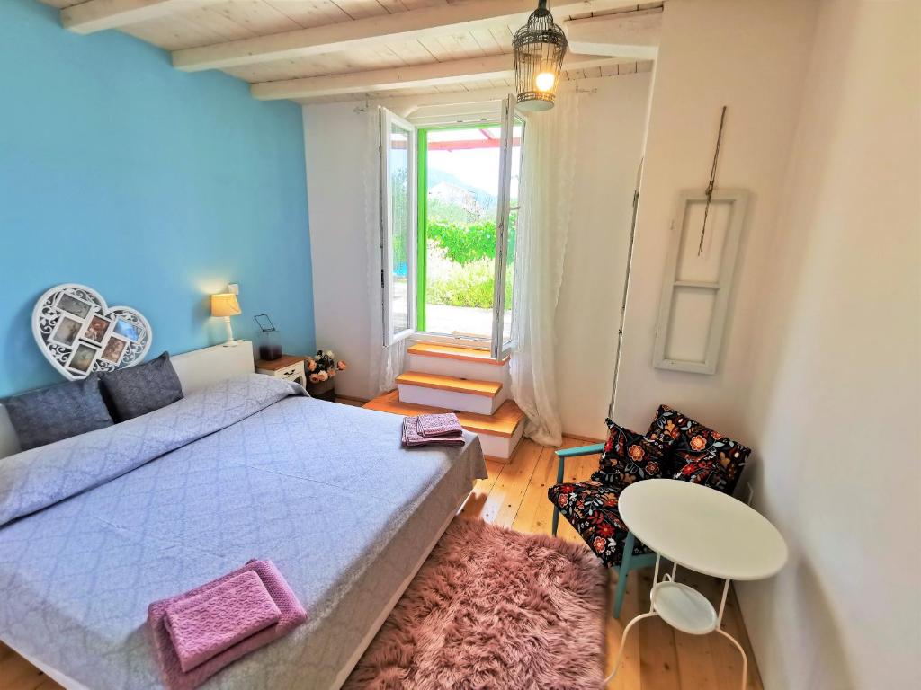 Postel nebo postele na pokoji v ubytování Villa Kućica