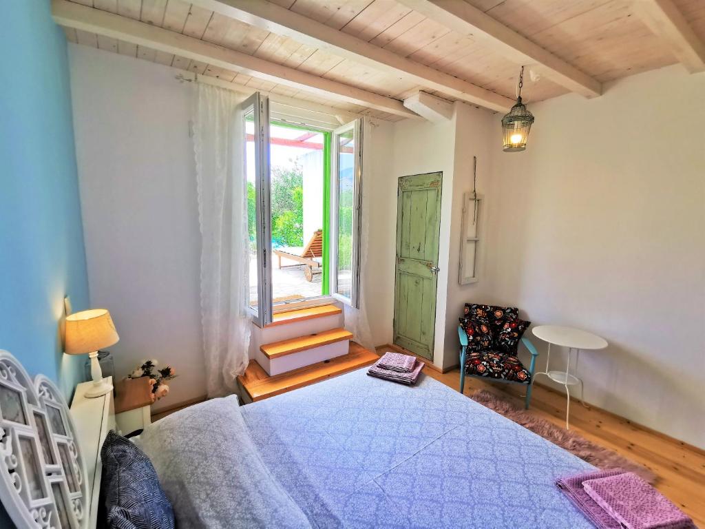 Postel nebo postele na pokoji v ubytování Villa Kućica