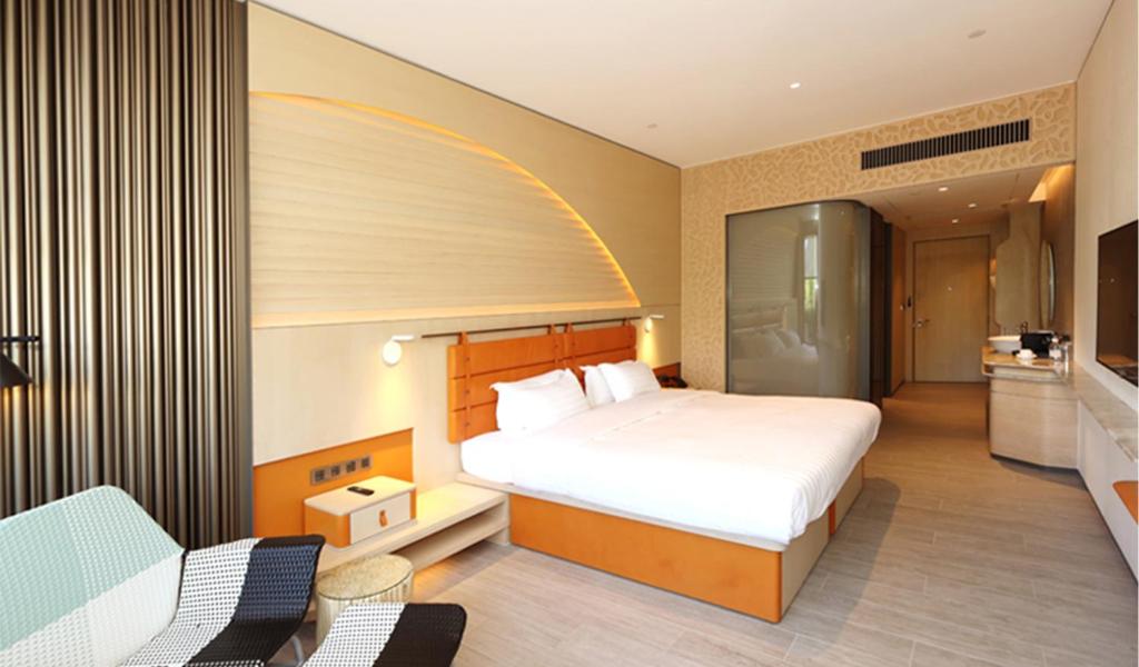 Ένα ή περισσότερα κρεβάτια σε δωμάτιο στο WM Hotel Hong Kong, Vignette Collection