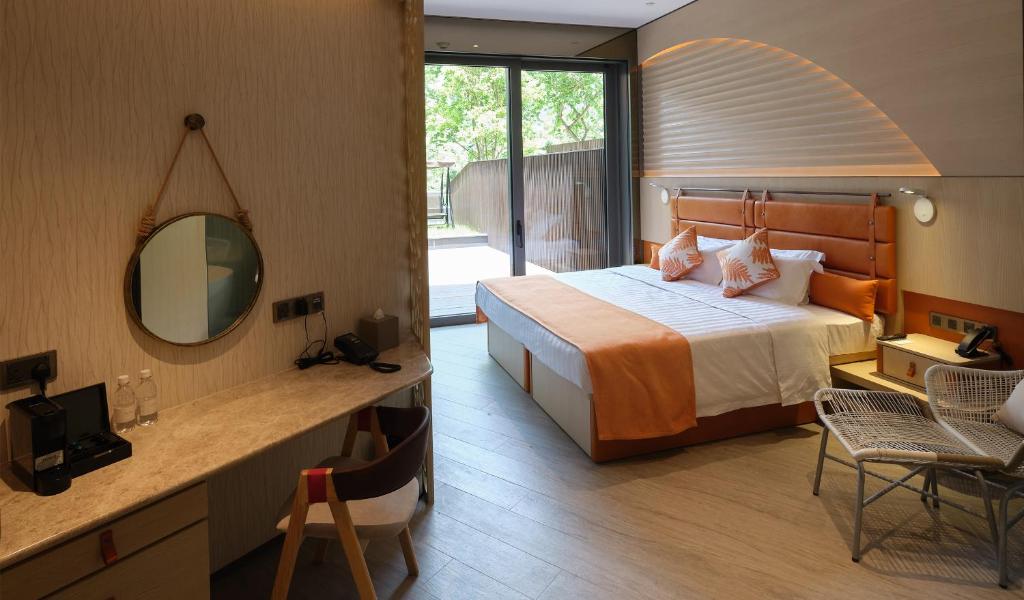 Ένα ή περισσότερα κρεβάτια σε δωμάτιο στο WM Hotel Hong Kong, Vignette Collection