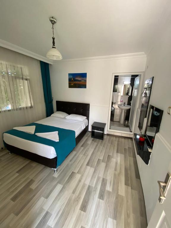 Postel nebo postele na pokoji v ubytování Sunrise Aya Hotel