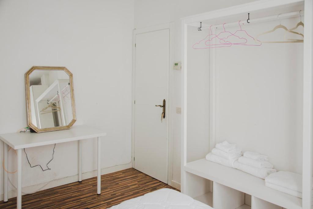 A bed or beds in a room at Ca Giardini Apartments in Biennale by Bricola Apartments
