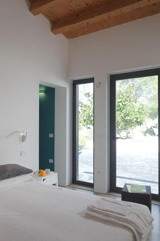 Postel nebo postele na pokoji v ubytování Agriturismo Casebianche