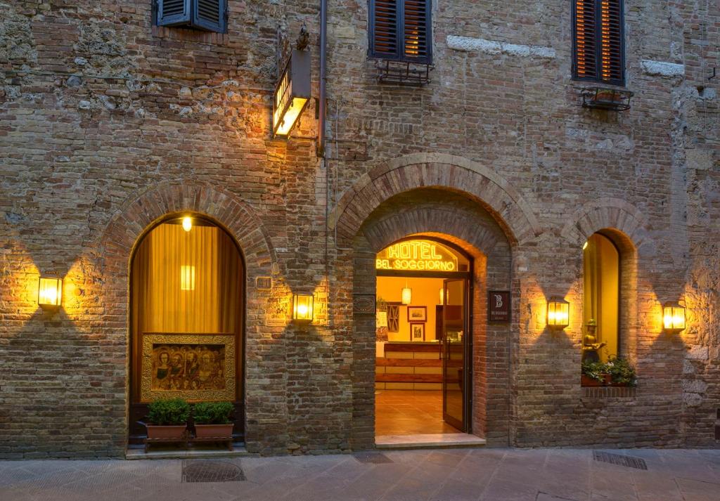 an entrance to a brick building with two arches at Hotel Bel Soggiorno in San Gimignano