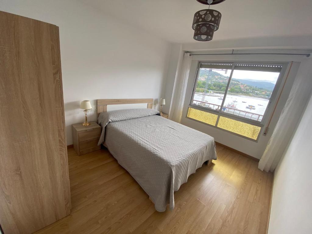 Posteľ alebo postele v izbe v ubytovaní Apartamento céntrico con vistas y cerca de playa