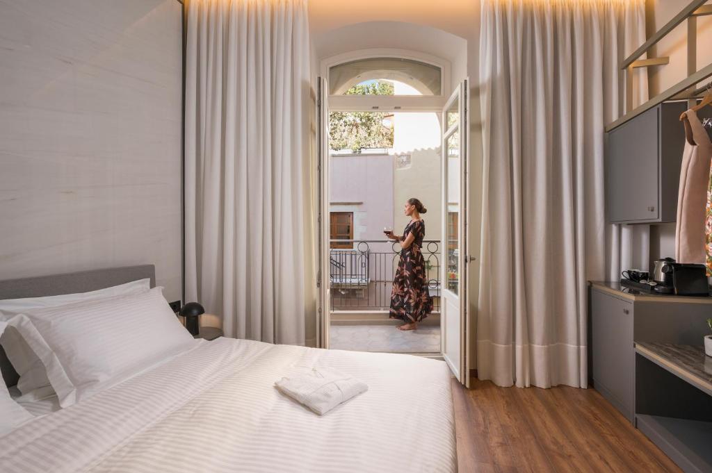 Ένα ή περισσότερα κρεβάτια σε δωμάτιο στο Veneri Boutique Suites