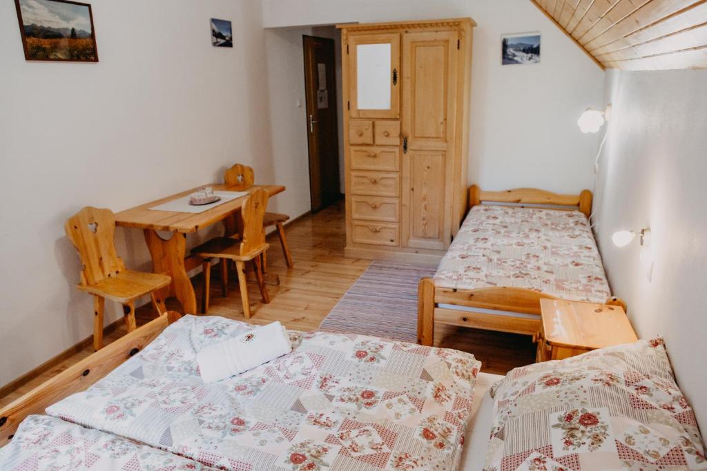Postel nebo postele na pokoji v ubytování Penzion Sindlovec