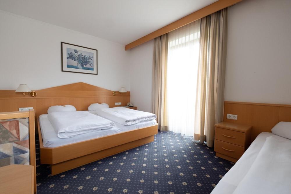 Postel nebo postele na pokoji v ubytování Garni Volgger