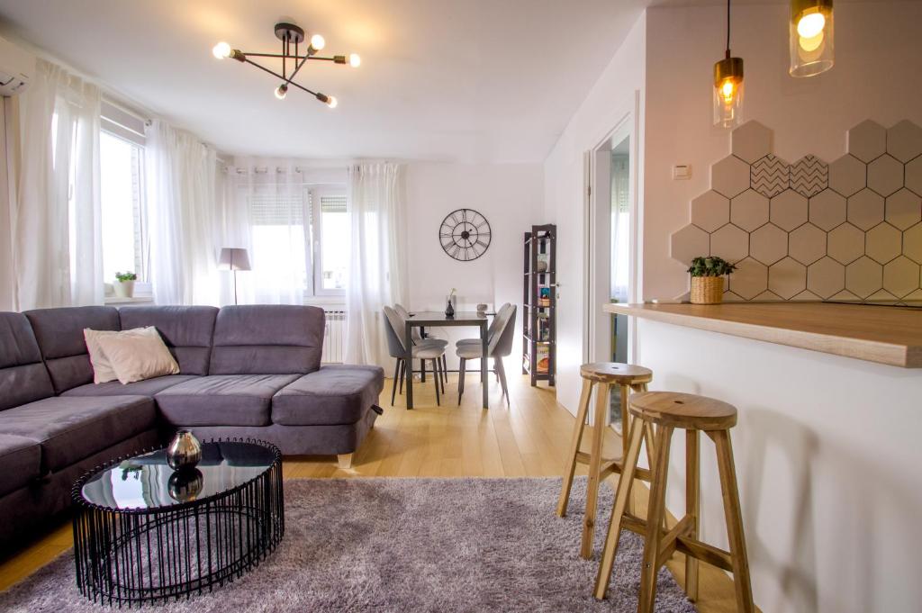 a living room with a couch and a table at Apartment Zagreb 213 in Zagreb