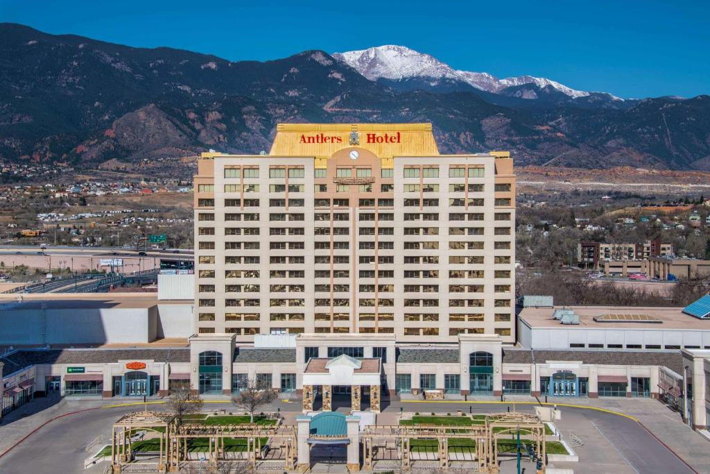 a large building with a clock on it at The Antlers, A Wyndham Hotel in Colorado Springs