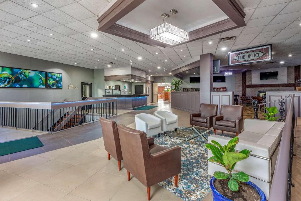 a lobby of a hospital with chairs and a bar at Quality Inn & Conference Centre Midland in Midland