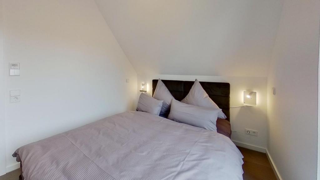 Postel nebo postele na pokoji v ubytování Haus Kleemann K4