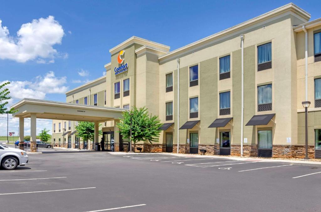 a hotel with a car parked in front of it at Comfort Inn & Suites Lynchburg Airport - University Area in Lynchburg