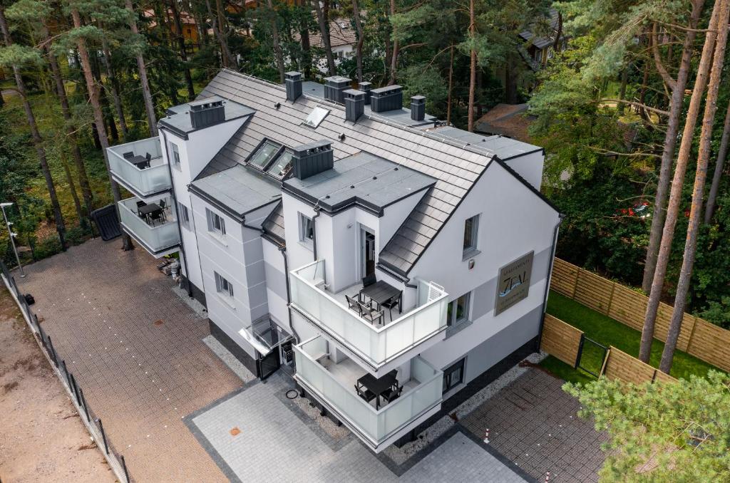 an aerial view of a white house at Apartamenty 7 Fal in Pobierowo