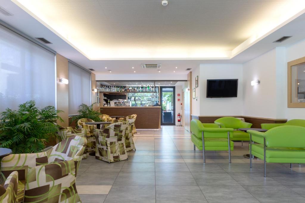 TV a/nebo společenská místnost v ubytování Hotel Campagnola