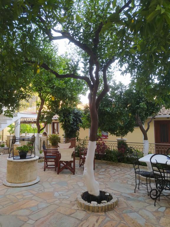 a statue of a tree in a courtyard at Villa Avli in Parga