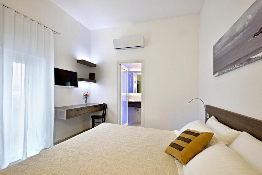 Een bed of bedden in een kamer bij Dimora Del Dragone