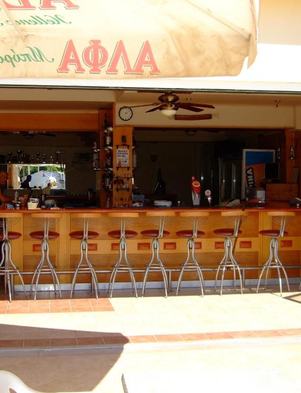 A restaurant or other place to eat at Antonios Hotel