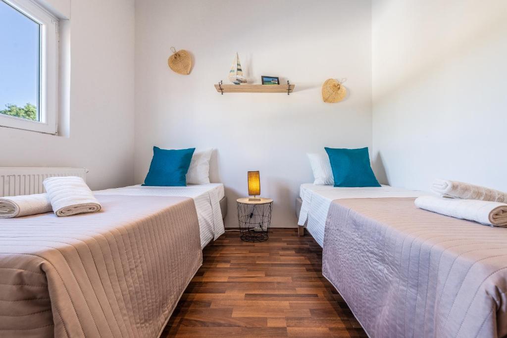 Postel nebo postele na pokoji v ubytování Apartman Luka