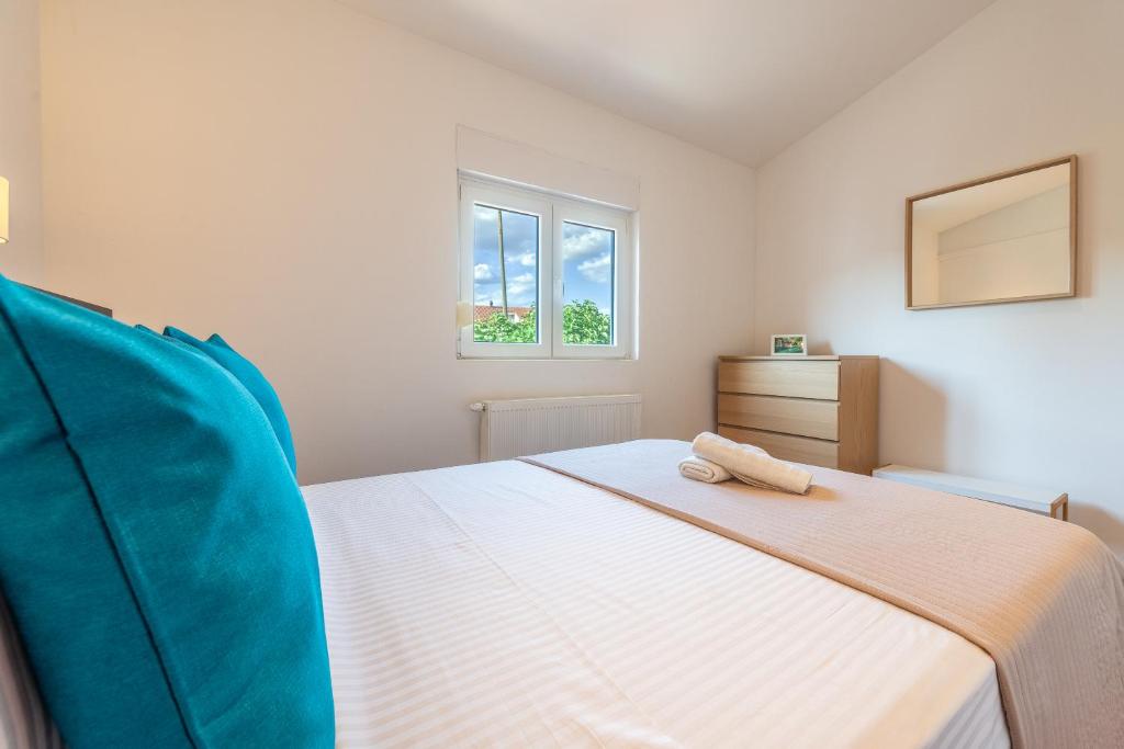 Postel nebo postele na pokoji v ubytování Apartman Luka