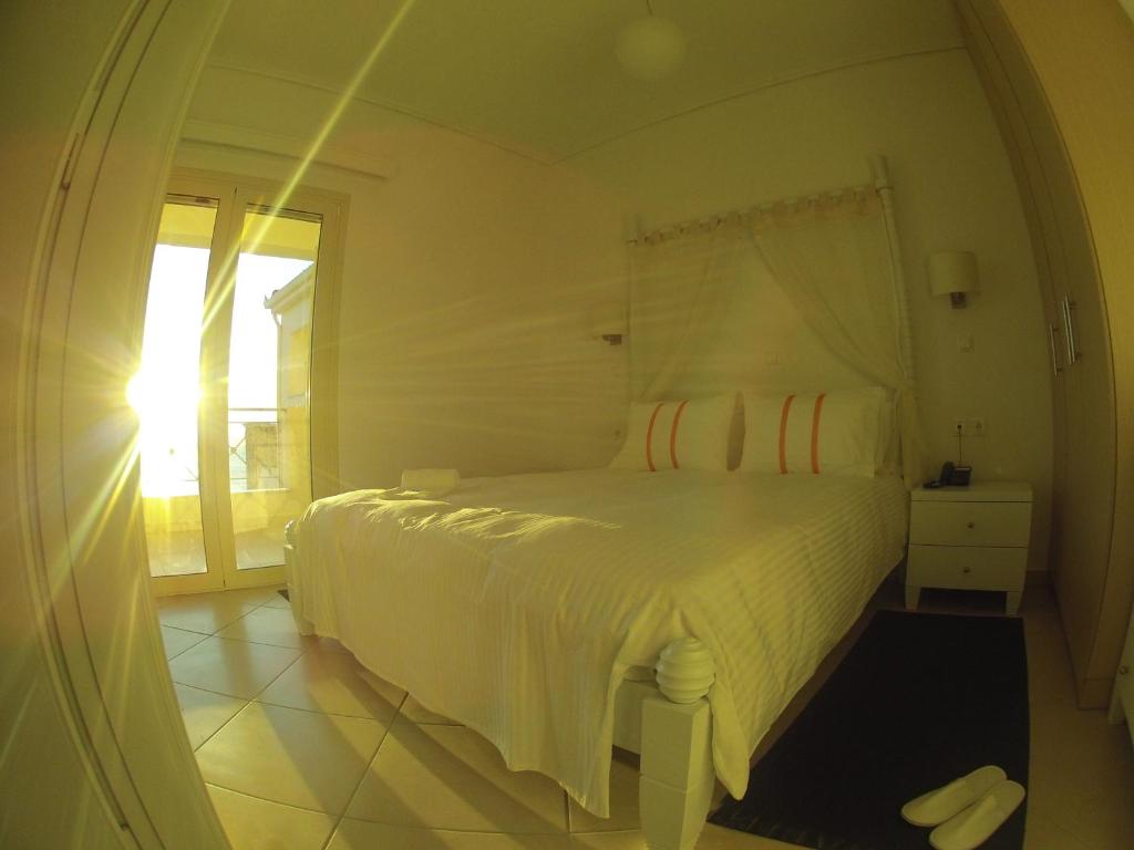 Postel nebo postele na pokoji v ubytování Thea Hotel - Studios & Suites