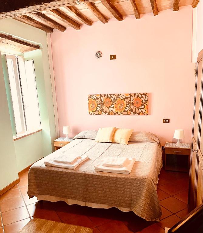 Postel nebo postele na pokoji v ubytování In Castello