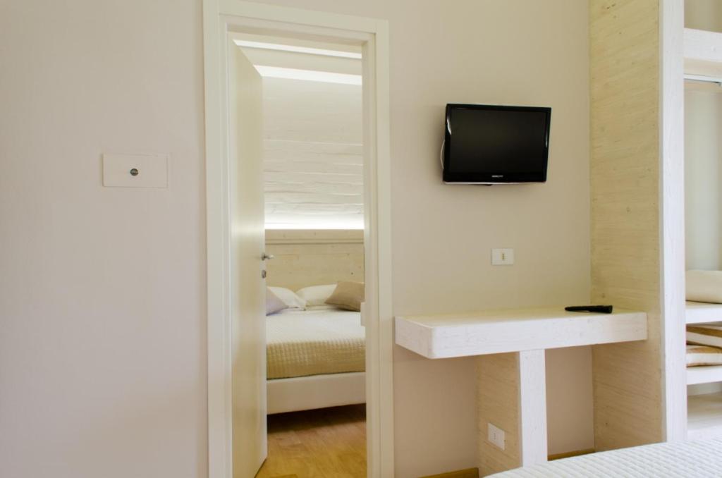 Postel nebo postele na pokoji v ubytování Mona Lisa Hotel