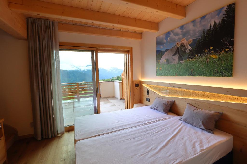 Postel nebo postele na pokoji v ubytování Agriturismo Maso Schneider