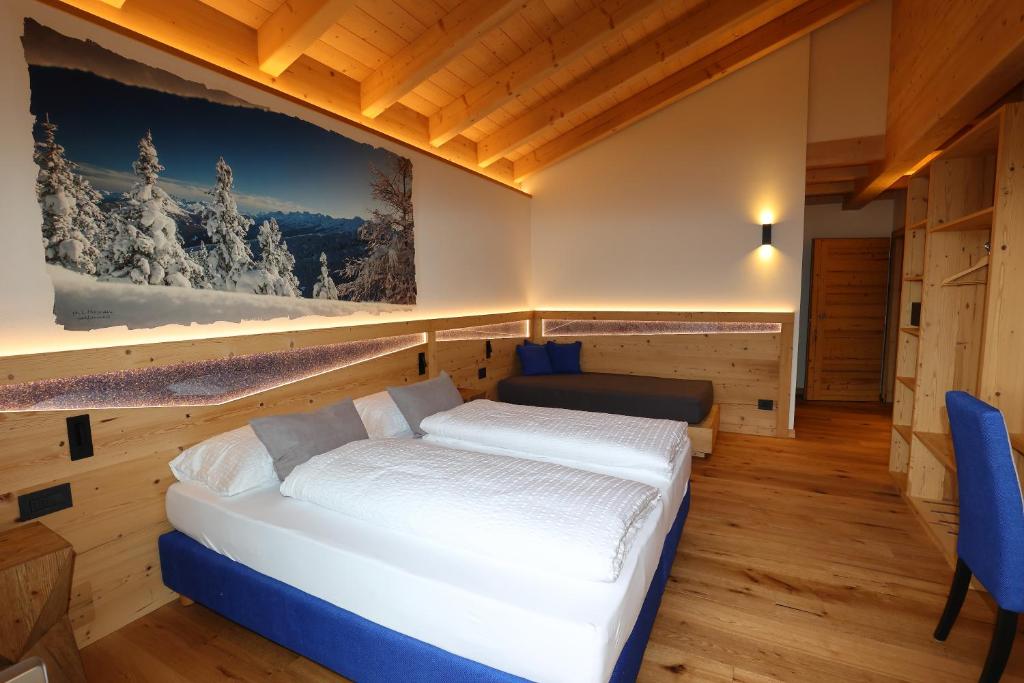 Llit o llits en una habitació de Agriturismo Maso Schneider