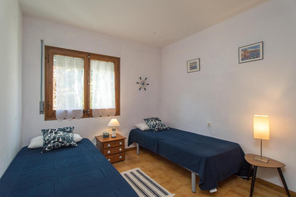 Postel nebo postele na pokoji v ubytování K-4 CALELLA DE PALAFRUGELL, 4 Pax