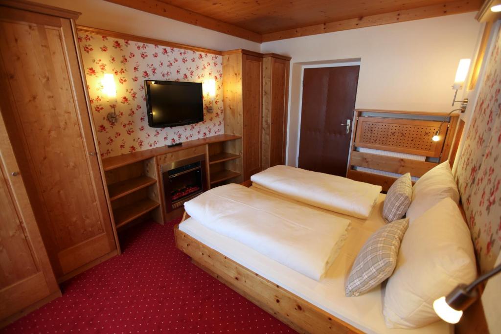 Letto o letti in una camera di Hotel Metzgerwirt