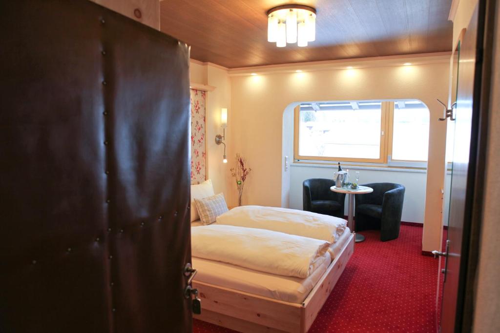 Letto o letti in una camera di Hotel Metzgerwirt