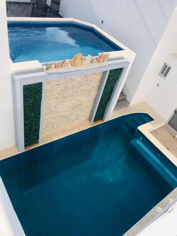 Bazén v ubytování Hotel Nuevo Bernal nebo v jeho okolí