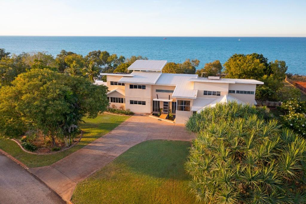 an aerial view of a house with the ocean in the background at Koolinda by the Bay, Broome WA in Broome