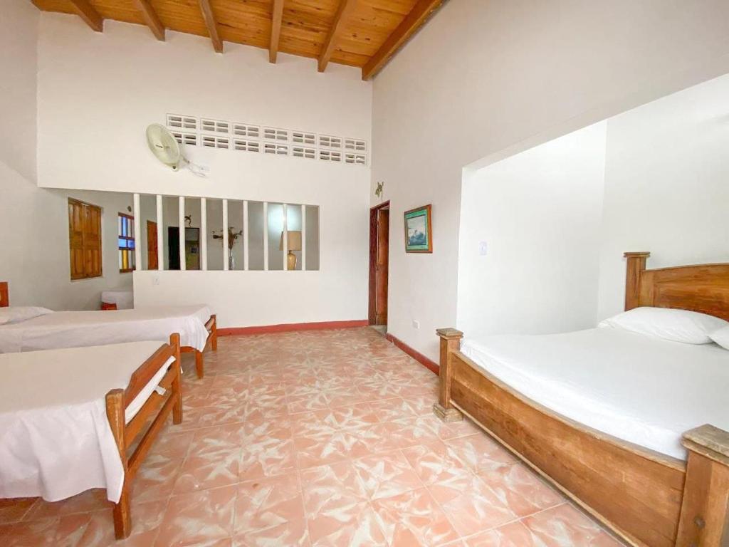 Postel nebo postele na pokoji v ubytování Hotel Refugio Bike