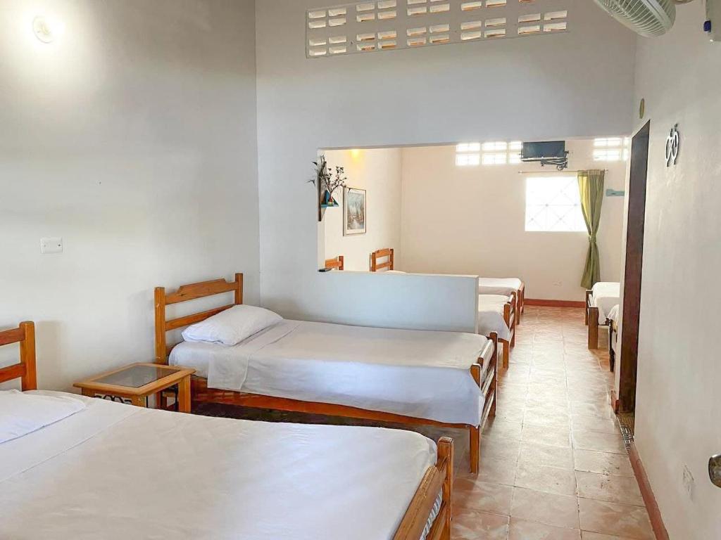Postel nebo postele na pokoji v ubytování Hotel Refugio Bike